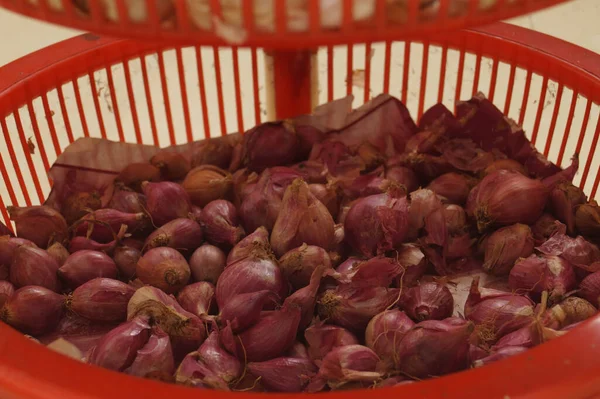 Shallot or small onion in the container