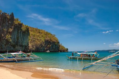 Motorised outrigger boats on the island of Palawan in the Philippines clipart
