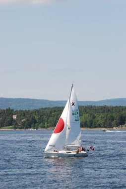 A beautiful summers day on the water in Oslofjord in Norway clipart