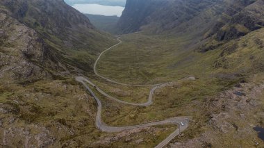 The narrow winding mountain road at Bealach na Ba near Applecross in the Scottish Highlands, UK clipart