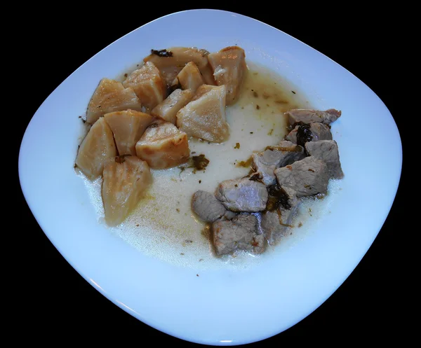 Свинина с сельдерей и картофель изолированы на черном — стоковое фото