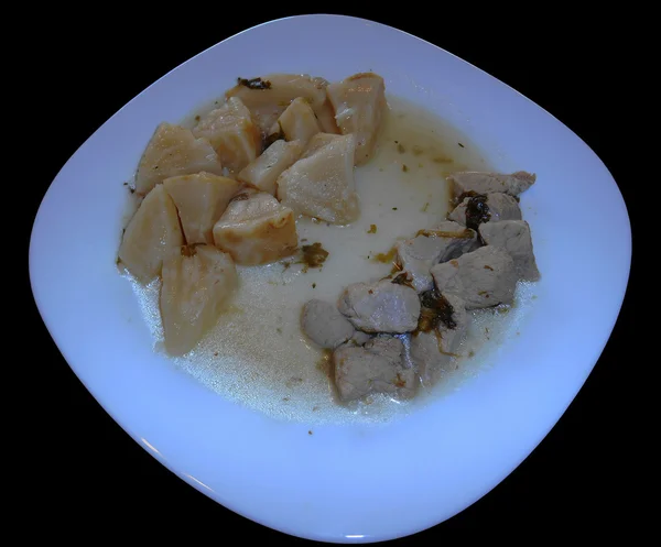 Pork with celeriac and potatoes isolated on black — Stock Photo, Image