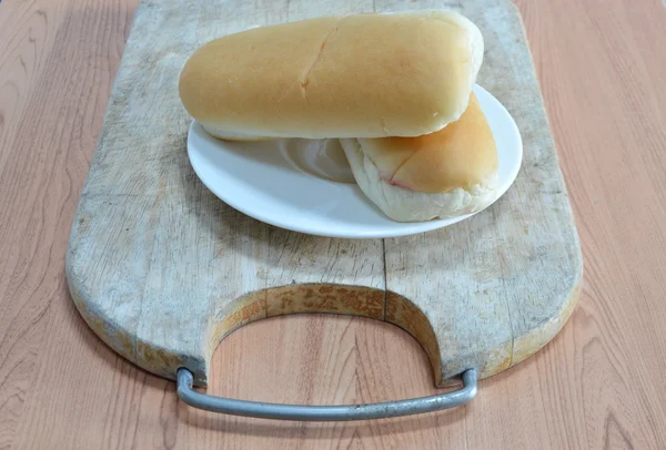 Bread on wooden chop block — Stock Photo, Image