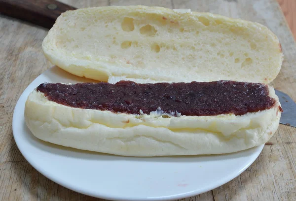 Bread filling red bean jam on dish — Stock Photo, Image