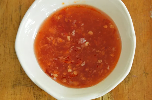 Chicken chili sauce in cup on table — Stock Photo, Image