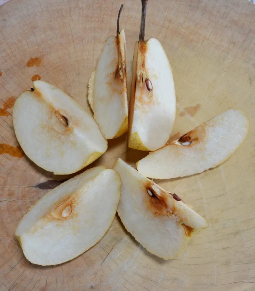 Chinese pear cut on wooden chop block — Stock Photo, Image