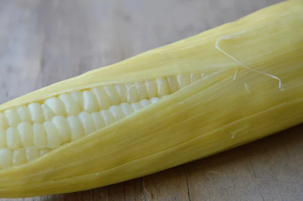 Corn on wooden board — Stock Photo, Image