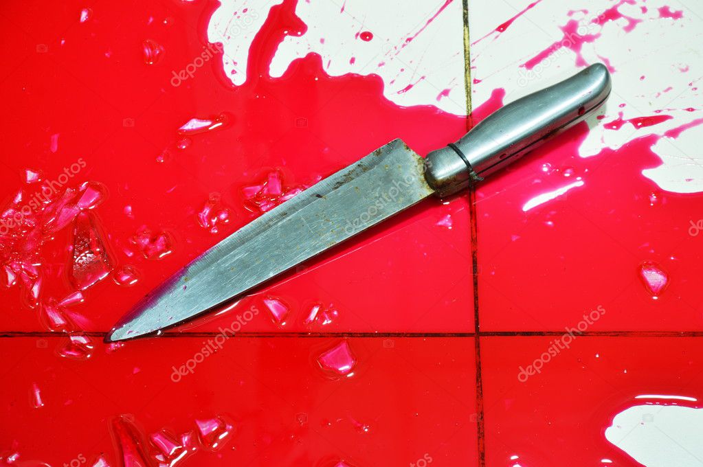 knife and lot of blood splash on tile floor