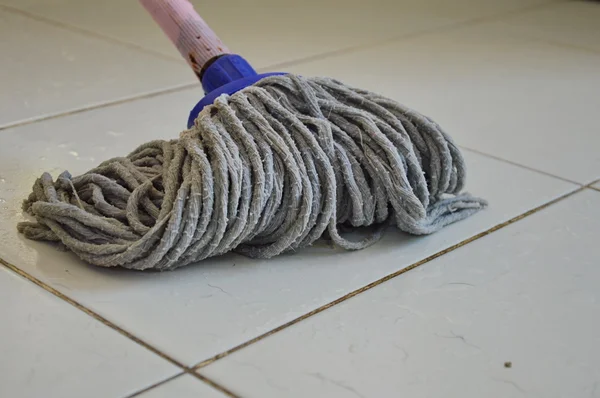 Mop the tile floor in home — Stock Photo, Image