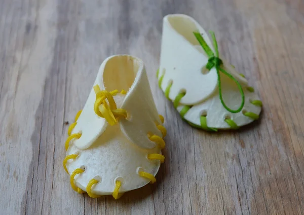 Dog snack shoe made by cow leather on wooden board — Stock Photo, Image