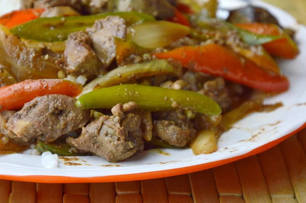 Spicy stir-fried chicken entrails with long sweet chili on rice — Stock Photo, Image