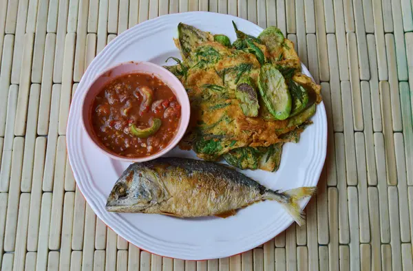 Deep fried mackerel and egg eat couple with shrimp chili paste on dish — Stock Photo, Image