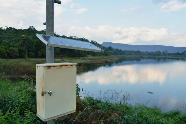 pluviometer or rain gauge in mountain background with rain cloud on sky