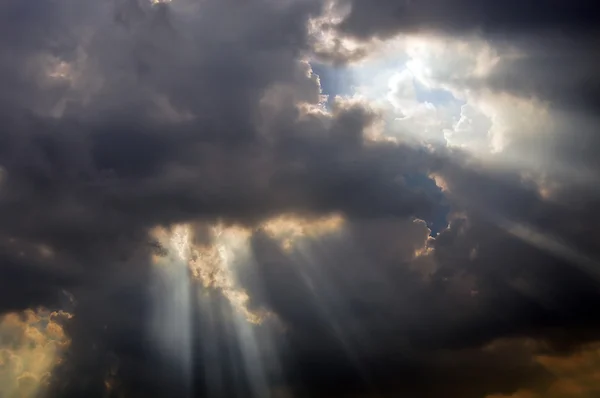 Beam through the dark cloud — Stock Photo, Image