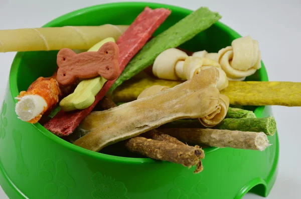 variety dog snack in green bowl