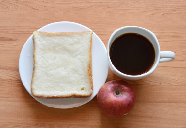 apple ile kahve ve dilim ekmek