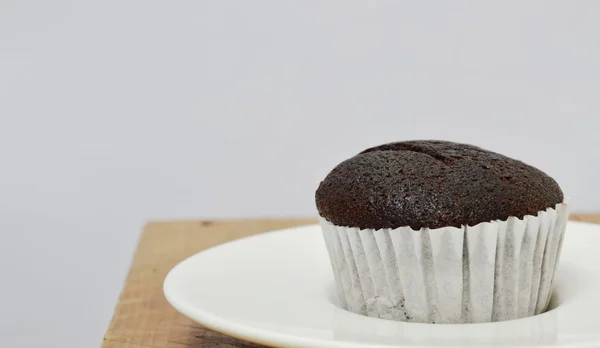Chocolate muffin on dish — Stock Photo, Image