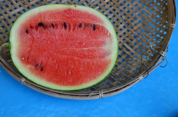 Watermelon on bamboo threshing basket — Stock Photo, Image