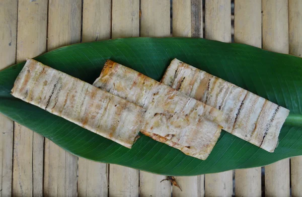 Grilled flat banana Cambodian food on banana leaf — Stock Photo, Image