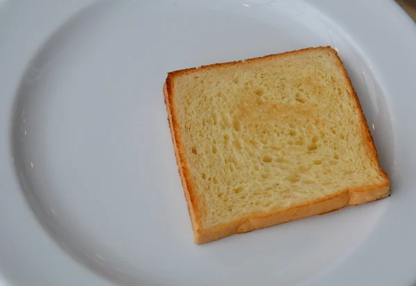 Toast on white dish — Stock Photo, Image