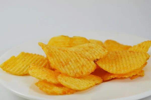Potato chip on dish — Stock Photo, Image