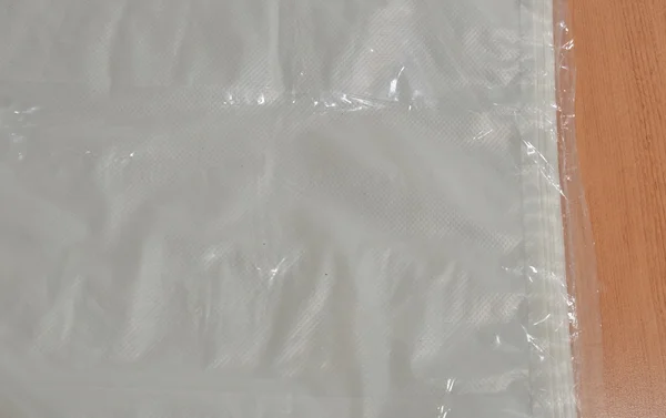 Embalagem de saco de plástico na mesa — Fotografia de Stock
