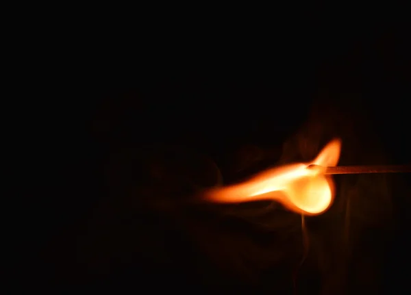 Match set fire in the dark — Stock Photo, Image
