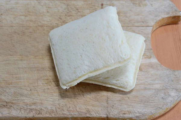 Sandwich on wooden chop block — Stock Photo, Image