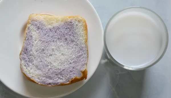 Milk and bread mixed with taro on dish — Stock Photo, Image