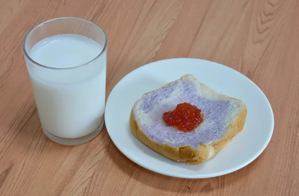 Milk and slice bread mixed with taro topping jam — Stock Photo, Image