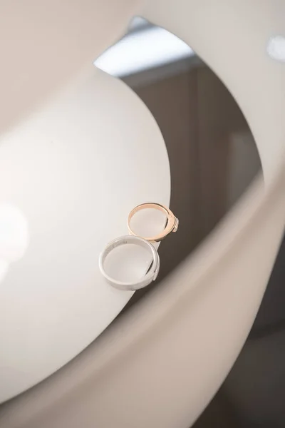 wedding rings on the table