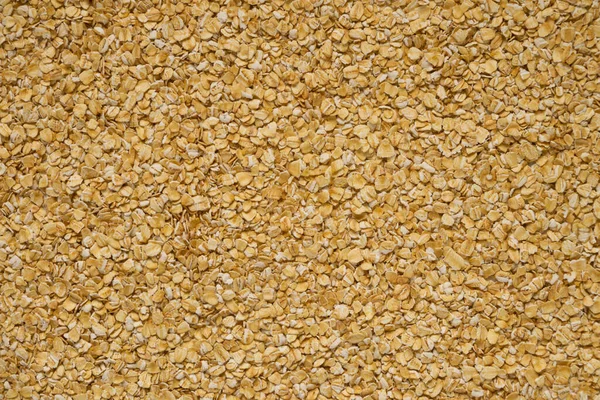 Large background of raw oatmeal for text overlay — 图库照片