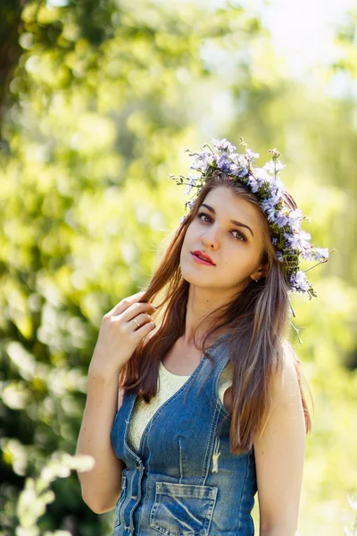 Young woman touching her hair, portrait at nature — Stock Photo, Image