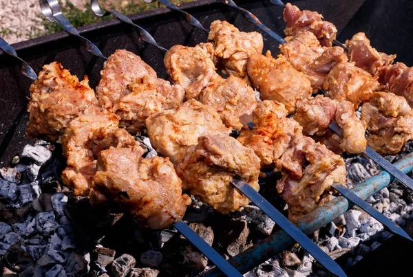 Meat kebabs grilling outside — Stock Photo, Image