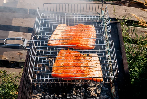 Salmon kebabs steak grilling outside — Stock Photo, Image