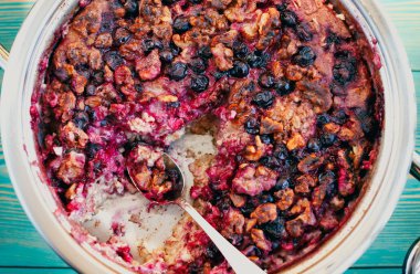 Baked oatmeal with blackberry and walnut, healthy dessert clipart
