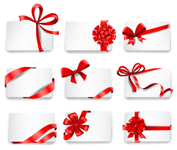 Festive cards with red gift ribbons.