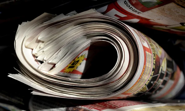 Rolled up newspaper — Stock Photo, Image