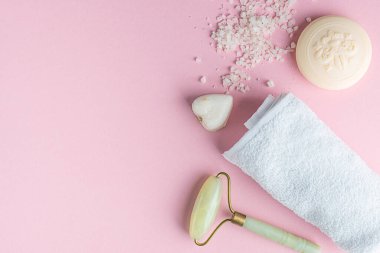 SPA concept, flat lay on a pink background