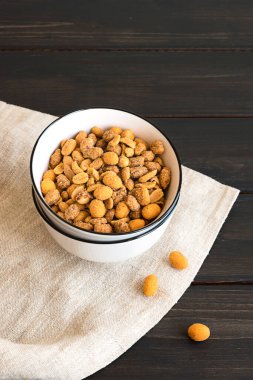 Spicy peanuts in a ceramic bowl