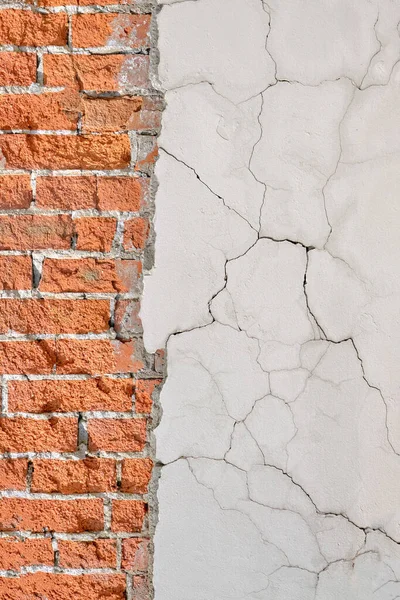 Background of retro red brick wall with fallen cement, concrete texture, copy space