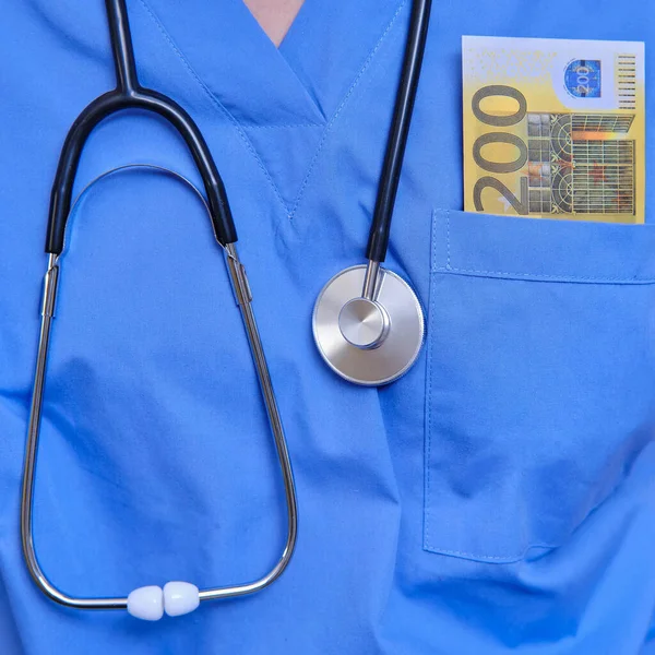 Euro bills are in the doctor\'s pocket. Concept of remuneration of medical workers in Europe.