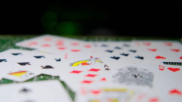 Playing cards on the background of computer technology and server equipment