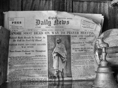 Vintage black and white close up of front page of Ceylon, now Sri Lanka, Daily News, with breaking news on assassination of Mahatma Gandhi on 30th January 1948 clipart