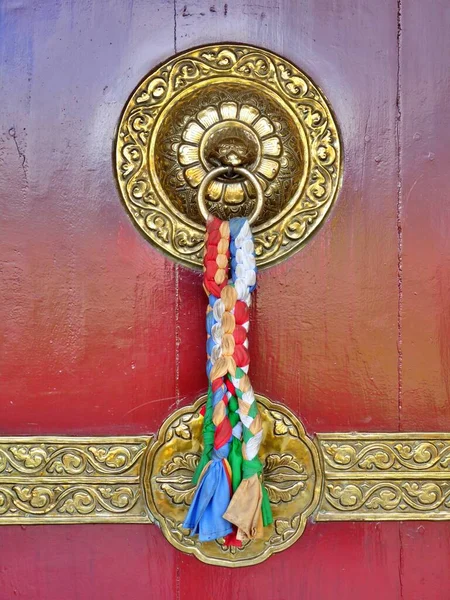 Traditional Tibetan style door decoration, monastery by Pokhara, Nepal