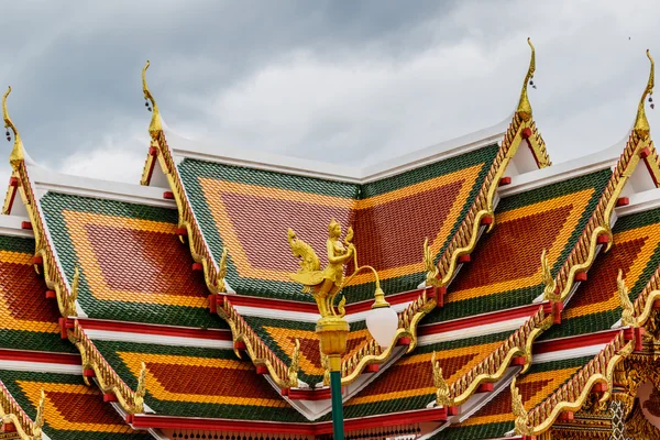 Thai art on roof Church at phathat Cheung choom woravihan temple — Stock Photo, Image