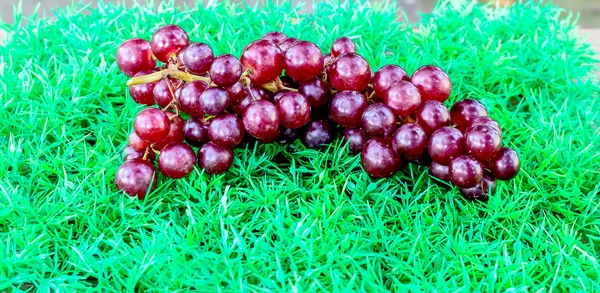 Grapes on artificial Turf — Stock Photo, Image