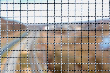 Mesh for industrial railroad fencing. Wire fence, protective grill