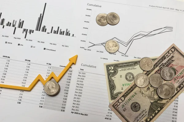 financial report. quarterly financial report on investments in the stock market. There are dollar bills on the reporting charts as a symbol of successful investments.