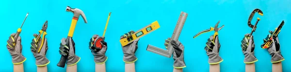 Tools in hand. Hands hold construction and carpentry tools, on a blue background. Banner, collage, construction and woodworking concept. — Stock Photo, Image